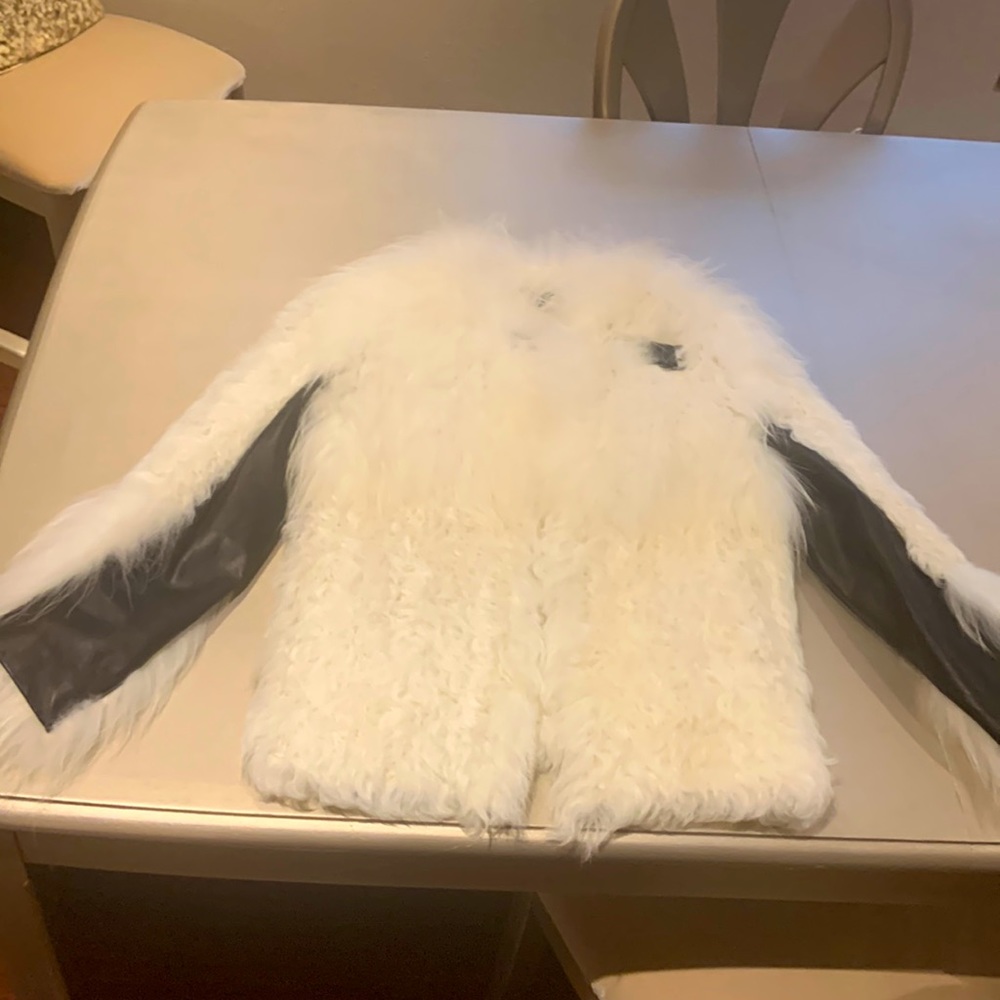 White fur with black leather jacket